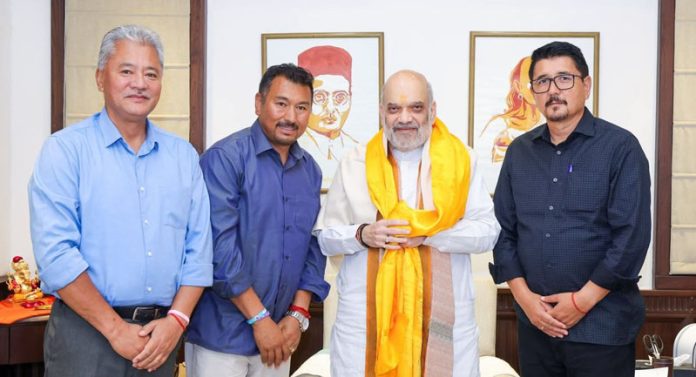CEC Leh Advocate Tashi Gyalson and top leaders of Ladakh BJP posing with Union Home Minister Amit Shah in Delhi. CEC Leh Advocate Tashi Gyalson and top leaders of Ladakh BJP posing with Union Home Minister Amit Shah in Delhi.