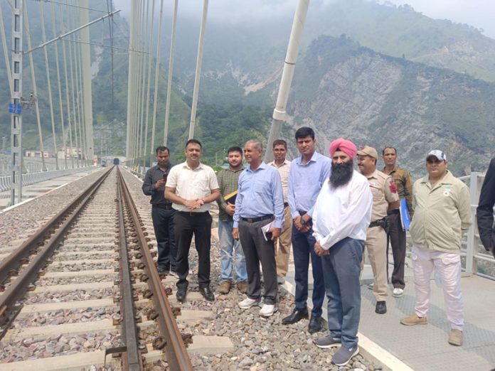 Officers inspecting a railway section between Katra & Budgam on Sunday.