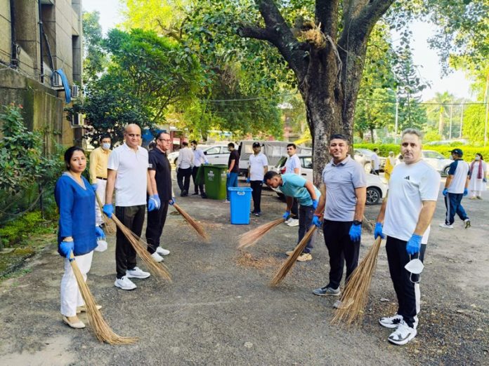 CID officers and staff engaged in cleanliness operation at CID Complex Jammu on Saturday.