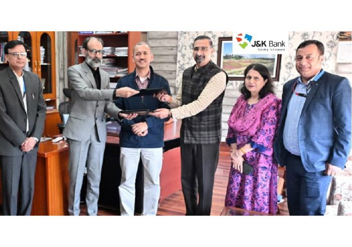 Officials of J&K Government and J&K Bank signing MoU on Monday. Officials of J&K Government and J&K Bank signing MoU on Monday.