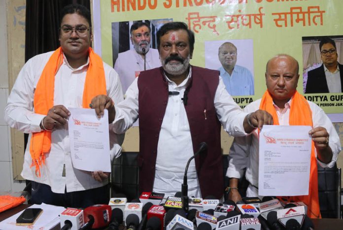 Anoop Pandey posing along with Vivek Gupta and Aditya Gupta in a press conference on Saturday.