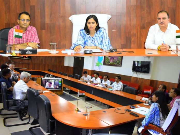 DC Reasi chairing a meeting on Monday.