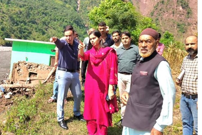 DC Nidhi Malik assessing damages caused by land sinking and adverse weather conditions in Sarh and Jamslan villages. DC Nidhi Malik assessing damages caused by land sinking and adverse weather conditions in Sarh and Jamslan villages.