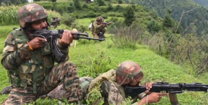 Security forces during gun battle at Seoj Dhar on Saturday. —Excelsior/Tilak Raj