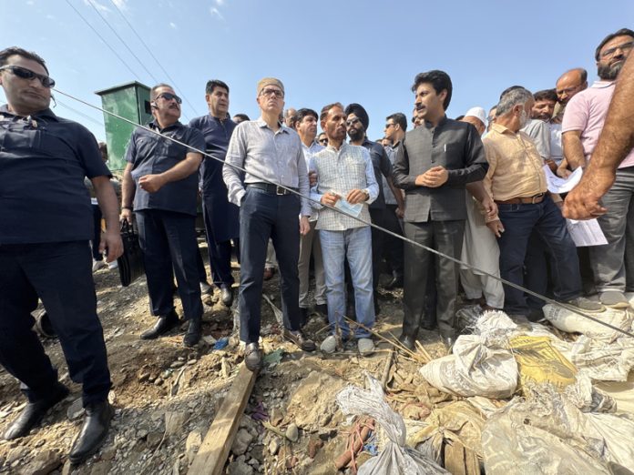 CM Omar Abdullah inspecting damage caused by floods in Anantnag on Saturday. — Excelsior/Sajad Dar