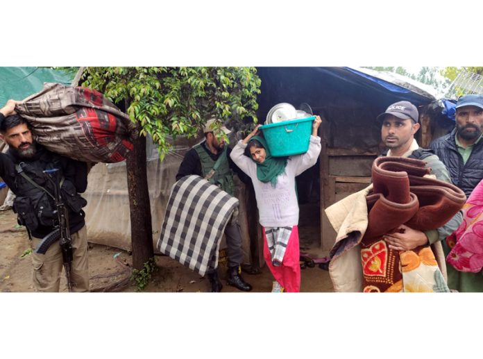 Police rescues nomads from flash floods in Kulgam area. -Excelsior/Sajad Dar