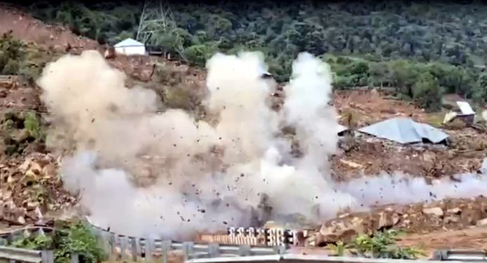 Clouds of smoke and dust coming out after blasting of rocks at Thard on National Highway near Udhampur. -Excelsior/K Kumar