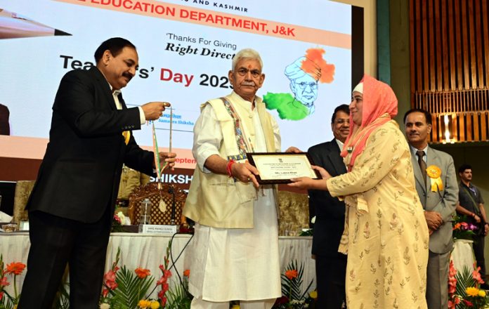 LG Manoj Sinha felicitating an award winning teacher in Srinagar on Friday. LG Manoj Sinha felicitating an award winning teacher in Srinagar on Friday.