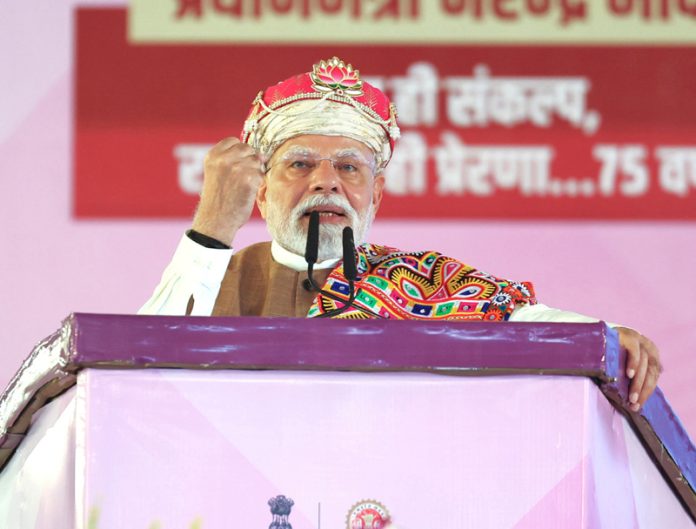 Prime Minister Narendra Modi addresses the foundation stone laying ceremony and the launch of various projects, in Dhar on Wednesday. (UNI) Prime Minister Narendra Modi addresses the foundation stone laying ceremony and the launch of various projects, in Dhar on Wednesday. (UNI)