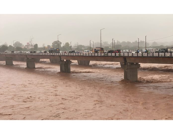 Flooded Tawi River in Jammu on Tuesday. -Excelsior/Rakesh Flooded Tawi River in Jammu on Tuesday. -Excelsior/Rakesh