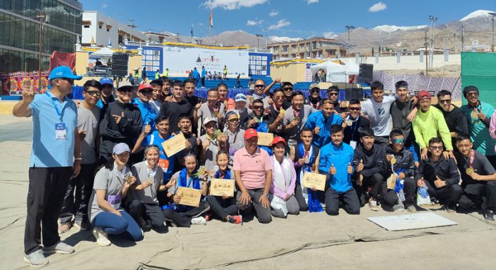 Participants of Ladakh Marathon posing along with certificates during closing ceremony.