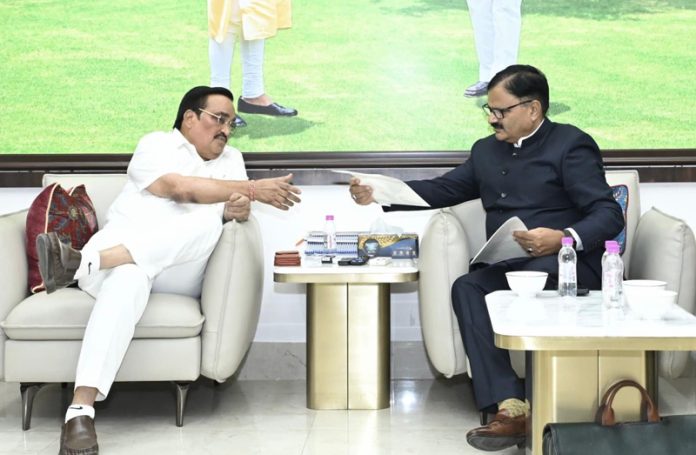 Javed Rana submitting a document to Union Jal Shakti Minister CR Patil on Thursday.