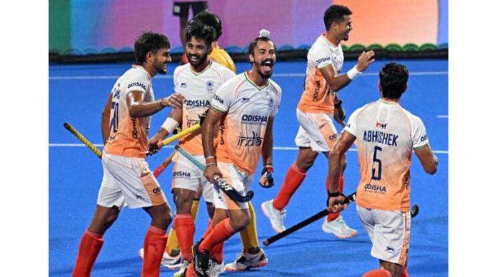 Indian hockey team celebrating after thrashing China by 7-0.