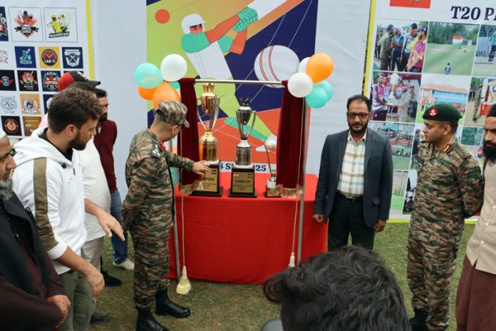 Dignitaries posing along with trophies.