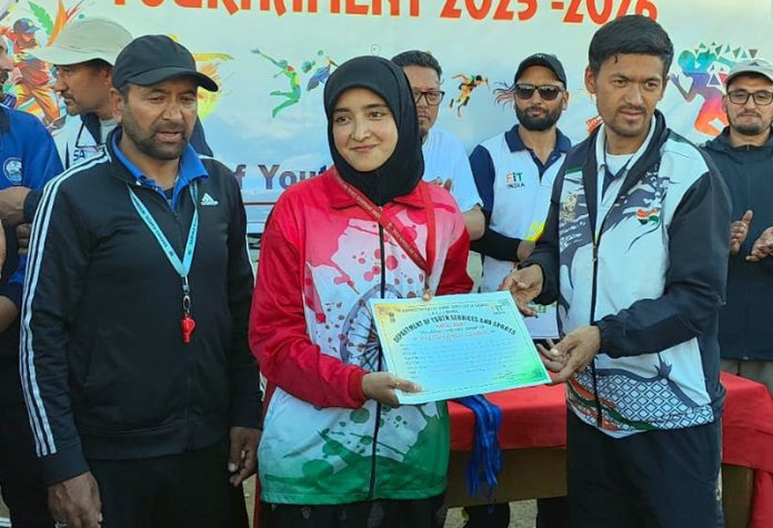 Winners receiving certificate during prize distribution ceremony.