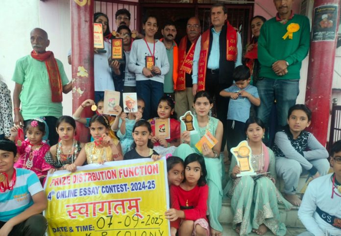 Winners of Essay contest posing with their awards.