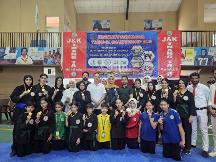 Athletes posing along with medals during closing ceremony.