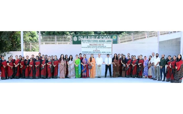 Teaching staff of Delhi Public School, Nagbani, Jammu posing for a group photograph.