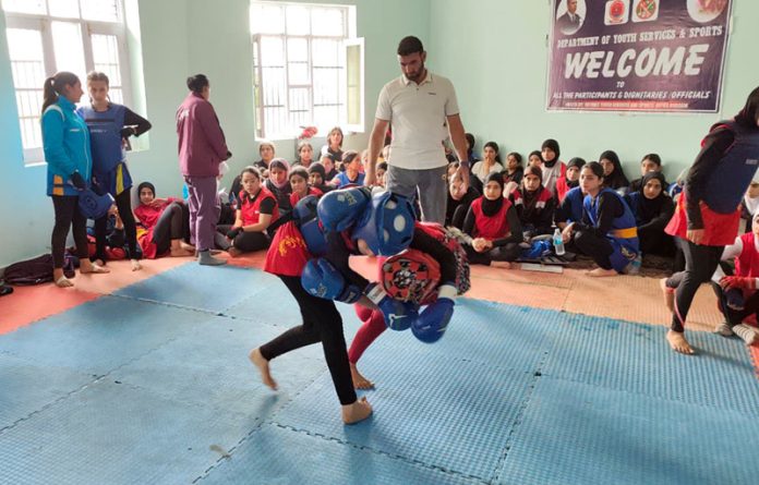 Girls in action during a Wushu match.