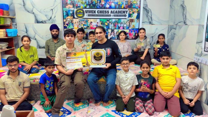 Budding players posing with International Chess Master Soham Kamotra and Coach Vivek Bharti at Vivek Chess Academy. Budding players posing with International Chess Master Soham Kamotra and Coach Vivek Bharti at Vivek Chess Academy.