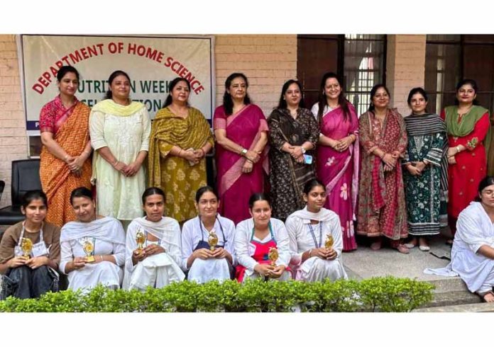 Faculty and students posing during a programme. Faculty and students posing during a programme.