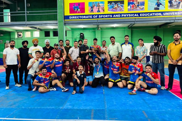 Champions of Inter-Collegiate Kabaddi (Men) Tournament posing with dignitaries.