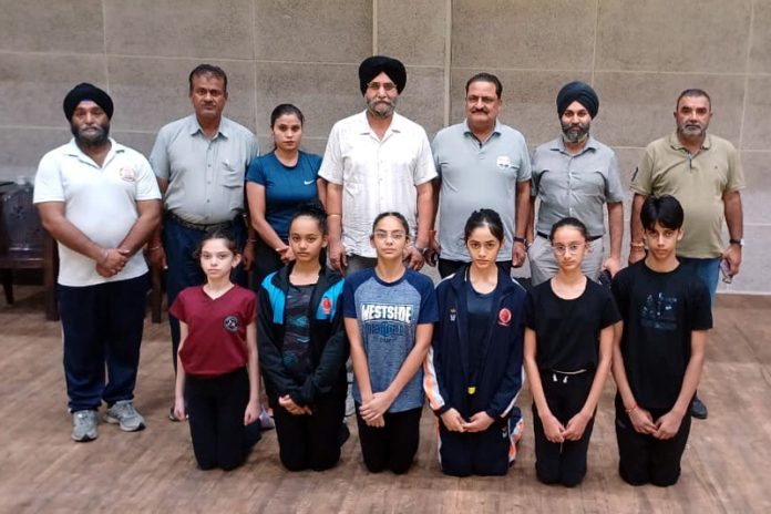J&K Aerobics team posing along with dignitaries.