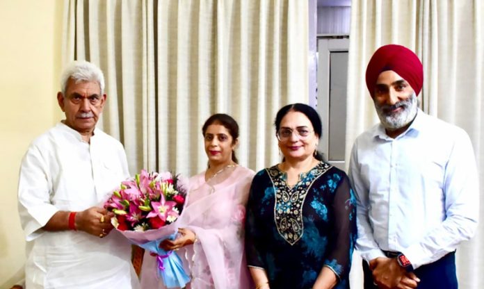 Management of Jammu Sanskriti School presenting bouquet to LG Manoj Sinha.