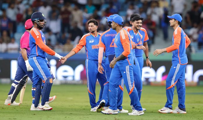 Players celebrating after Kuldeep Yadav takes a wicket against UAE at Dubai.