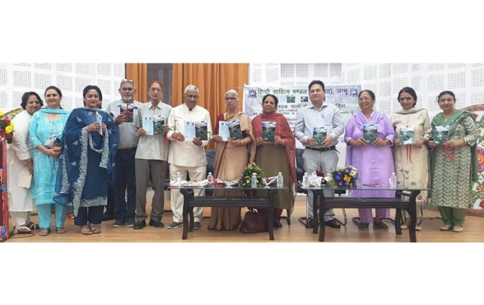 Dignitaries releasing a Hindi poetry collection in Jammu.