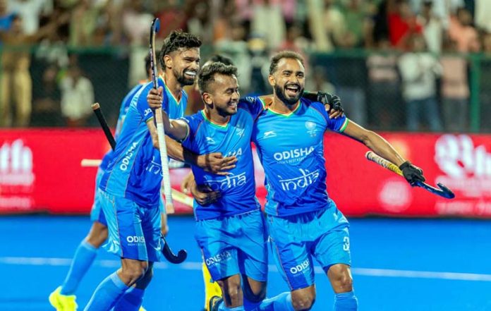 Indian hockey players celebrating after defeating Malaysia. Indian hockey players celebrating after defeating Malaysia.