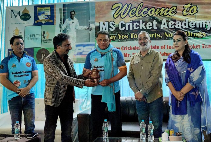 Former India Cricket team captain Mohammad Azharuddin receiving memento during a specialized training camp for budding players in Srinagar on Sunday. -Excelsior/Shakeel Former India Cricket team captain Mohammad Azharuddin receiving memento during a specialized training camp for budding players in Srinagar on Sunday. -Excelsior/Shakeel