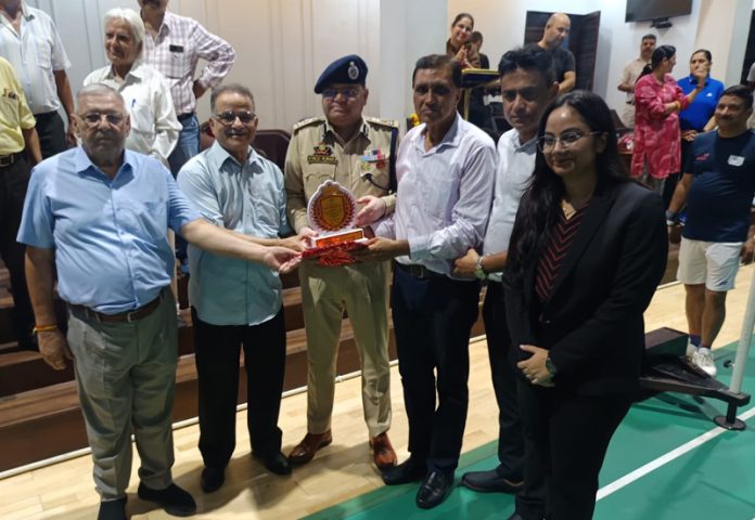 DIG IRP Jammu Zone Vinod Kumar receiving memento during an event.