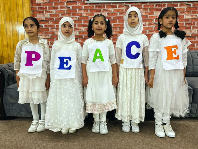 Children posing during a programme at Pulwama.
