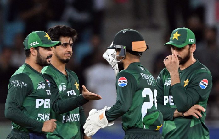 Pakistan players after defeating Oman in Asia Cup match on Friday.