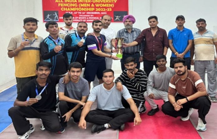 Winners posing along with trophy and dignitaries.