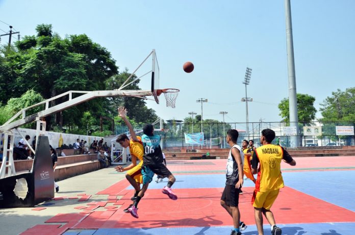 Basketball players in action during a match in Jammu. Basketball players in action during a match in Jammu.