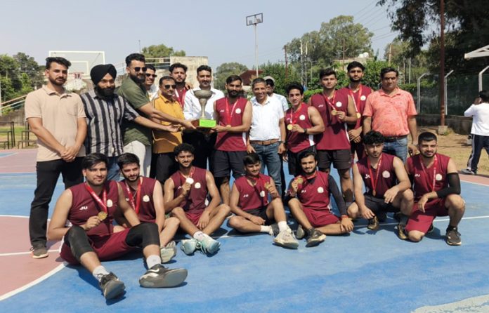 Winners in both men's and women's categories of Inter-Collegiate Basketball Tournament 2025-26 pose for a photograph with others.