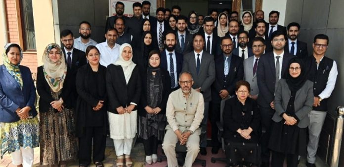 Justice Rahul Bharti alongwith participants during a workshop at Srinagar on Friday. Justice Rahul Bharti alongwith participants during a workshop at Srinagar on Friday.
