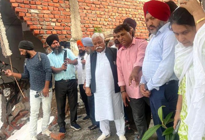 NC leader Ajay Kumar Sadhotra during visit to a flood hit village in Jammu. NC leader Ajay Kumar Sadhotra during visit to a flood hit village in Jammu.