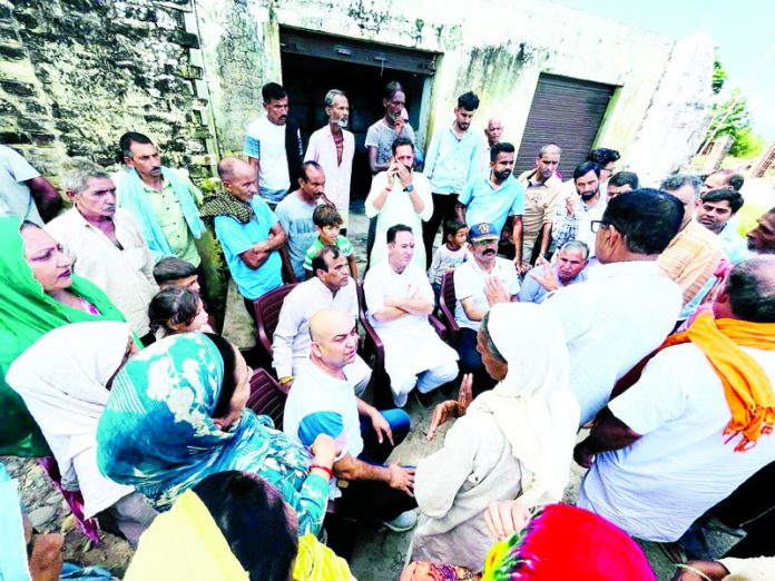 Leader of Opposition, Sunil Sharma interacting with the flood hit people in Akhnoor on Friday.