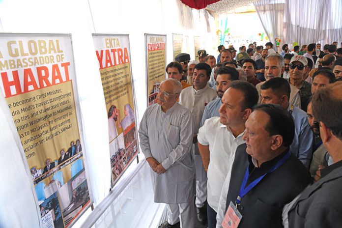 BJP leaders during an exhibition on the journey of Prime Minister Narendra Modi at Clock Tower, Srinagar. — Excelsior/Shakeel BJP leaders during an exhibition on the journey of Prime Minister Narendra Modi at Clock Tower, Srinagar. — Excelsior/Shakeel