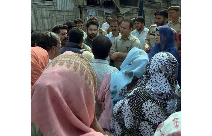 Leader of Opposition, Sunil Sharma during tour to flood hit areas in Srinagar on Thursday.