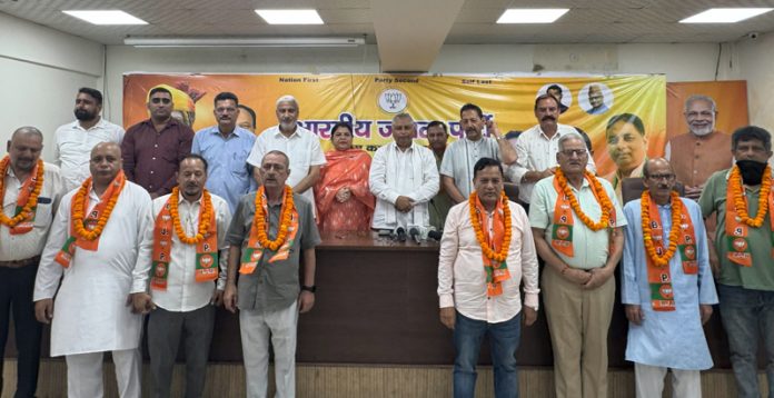 BJP leaders taking new entrants into party fold at Jammu on Friday.