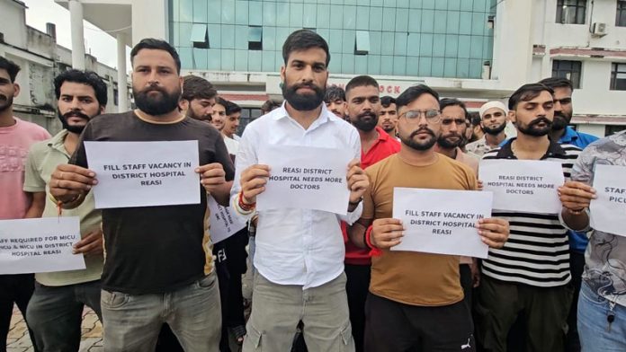 Youth stage protest against J&K Health authorities for shortage of staff at Reasi hospital on Friday. - Excelsior/ Ramesh Mengi.