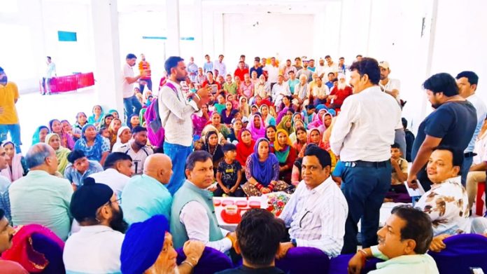 MLA Dr Bharat Bhushan distributing relief material during a camp in Kathua.