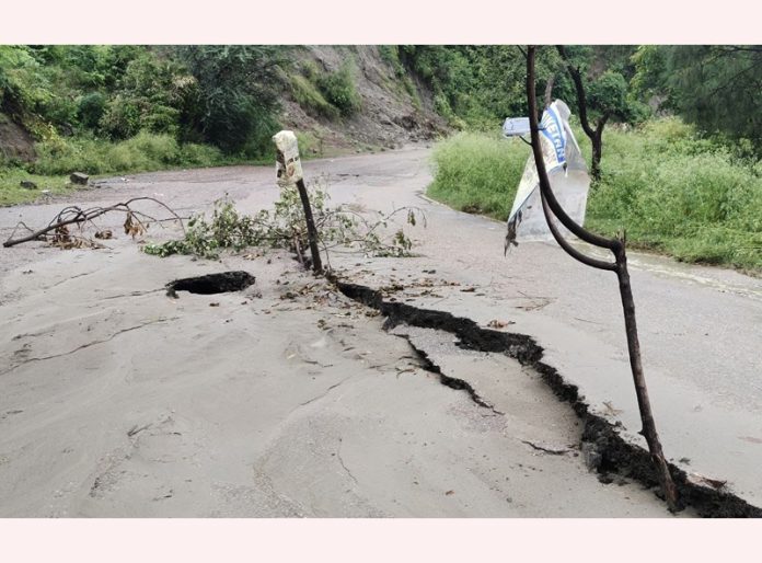 A portion of Mansar-Udhampur road near Jamoda village which caved in due to heavy rains. —Excelsior/Nischant