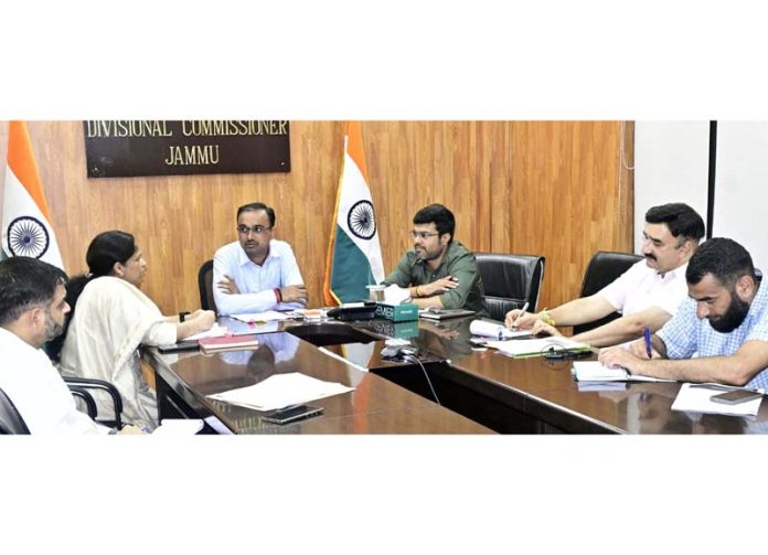 Div Com chairing a meeting on Thursday.