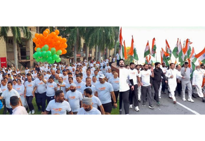 BJP and BJYM leaders taking out Namo run in Jammu (left) and at Srinagar (right) on Sunday. -Excelsior/Rakesh