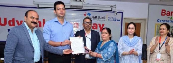 Sanction letters being provided to the entrepreneur under J&K Bank's Mission Yuva by the dignitaries in Jammu on Friday.